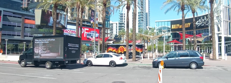 Mobile Billboards advertising promoting the Verizon's Blazing fast 5G Home Internet on a sunny city street.