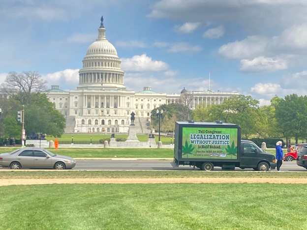 Mobile Billboards ad: Legalization without justice is half-baked" message on Cantmiss.US truck at Capitol Hill.