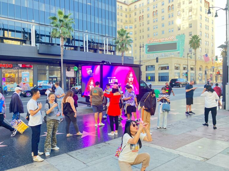 Cantmiss.US Mobile Billboard Truck showcasing a vibrant Amazon Music promotion featuring artist LATTO under LA's bustling street scene