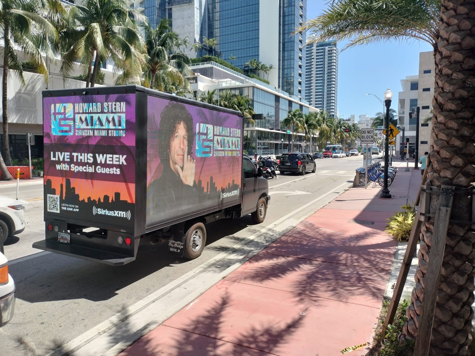 Miami Mobile Billboard shows SiriusXM Ad with Live with Howard Stern. Howard Stern is smiling on a Mobile LED display truck.