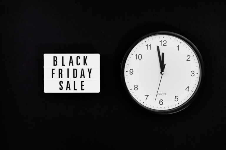 Clock showing time near Black Friday Sale sign.