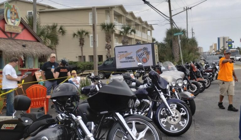 Can't Miss US: Miller Lite ad on a mobile billboards advertisement parked by a lineup of motorcycles and onlookers at Thunder Beach.