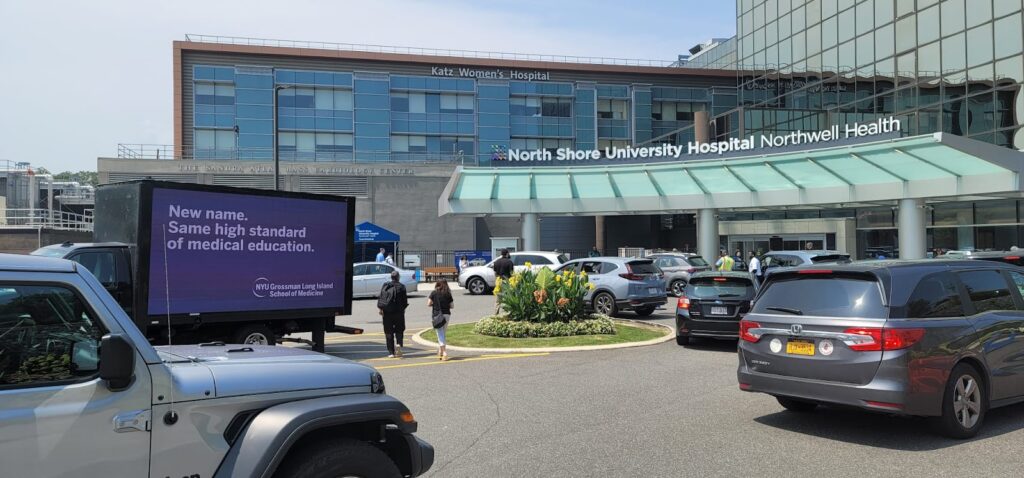 Cant Miss US's Billboard trucks advertisement at North Shore University Hospital promoting NYU Grossman Long Island School of Medicine.