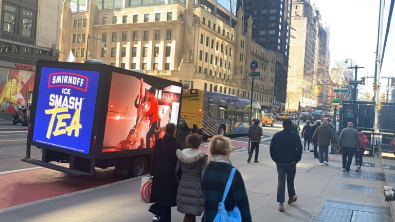 The image highlights Mobile Billboards Are Better Option to Traditional Billboard for Smirnoff Ice Smash Tea on a busy New York street