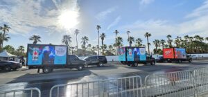 Three mobile billboard truck advertising by Heineken with beverage ads saying "All the dance moves. None of the Judgement" for the Coachella.